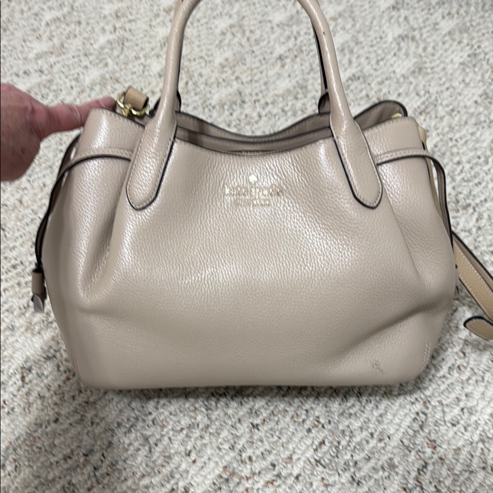 Kate Spade Dumpling Cream Satchel with Rolled Handles.
